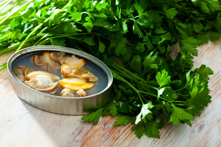 Opened tin can of shellfish fillet in oil