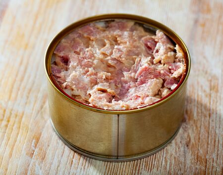 Canned meat food, preserved stewed meat on wooden tableの写真素材