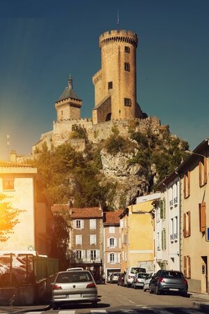 View from city streets on towers of medieval fortress Chateau de Foix, Franceのeditorial素材