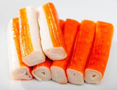Crab sticks group on white plateの写真素材