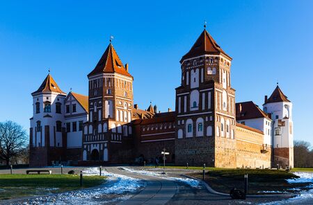View of impressive building in Belarusian Gothic style of medieval fortified Mir Castle on sunny winter day, Grodno regionのeditorial素材