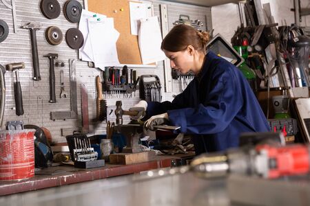 Portrait of professional woman worker during work in workshopの写真素材