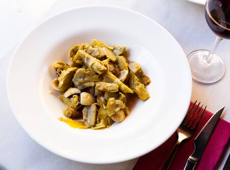 Appetizing artichokes with sea shellfishの写真素材