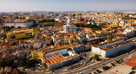 Picturesque aerial view of historical district of Lisbon on bank of Tagus river with medieval Monastery and white baroque building of Church of Santa Engracia, Portugalのeditorial素材