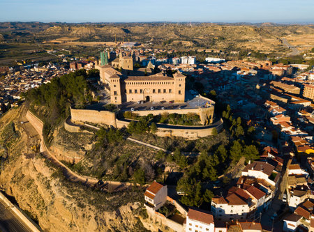 Picturesque autumn landscape with imposing medieval Calatrava Castle in Spanish town of Alcaniz