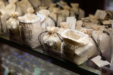 WIELICZKA, POLAND - MARCH 11, 2020: Small bags with rock salt on showcase of Wieliczka salt mine souvenir shopのeditorial素材