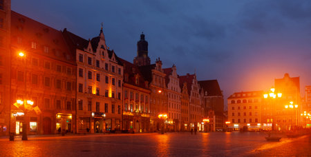 WROCLAW,  POLAND - MARCH 13, 2020:  Market Square with old buildings in the evening in Wroclaw,...