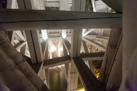 WIELICZKA, POLAND - MARCH 11, 2020: Wooden strengthening constructions over underground lake in historical salt mine in Wieliczka, Krakowのeditorial素材
