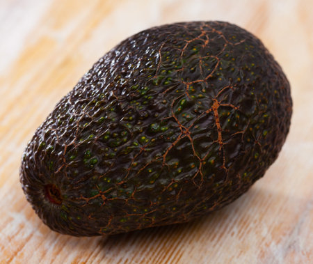 Tasty avocado on wooden surface