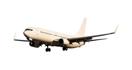 Flying commercial airplane isolated over white backgroundの写真素材