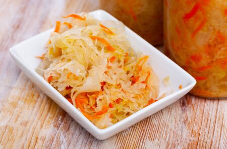 Homemade sauerkraut on white plate, healthy fermented foodの写真素材