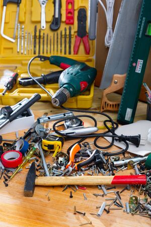 Construction tools and materials on wooden background, repair maintenance conceptの写真素材