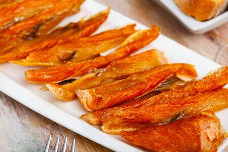 Close-up of cold smoked salmon belly at plate, nobodyの写真素材