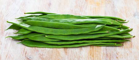 Fresh green beans on wooden background, nobodyの写真素材