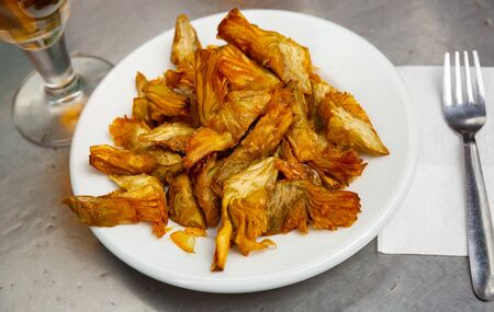 Plate of tasty roasted artichokes closeup. Spanish dishの写真素材