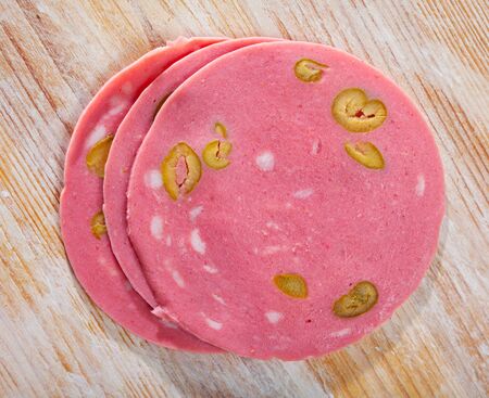 Sliced Mortadela with olives, popular catalan variant of italian mortadella sausageの写真素材