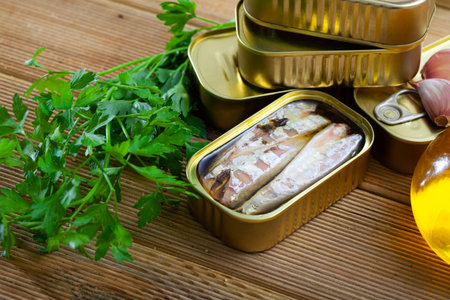 Canned seafood, headless mackerel fish preserved in oil on wooden table