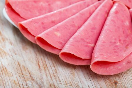 Sliced turkey Mortadela tender sausage, popular cold cut in Spainの写真素材