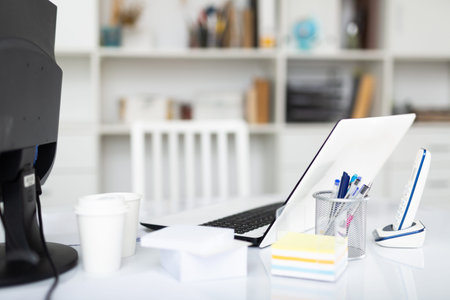 Interior of a modern office. Notebook and other office supplies