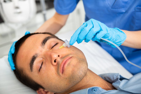 Male client getting carbon dioxide injections for face skin