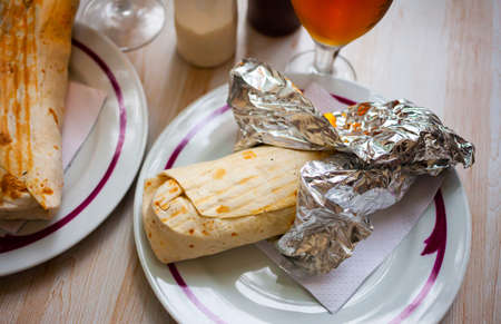 Turkish wrapped dish durum on white plateの写真素材