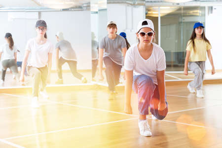 Teenagers training hip hop in dance studioの写真素材