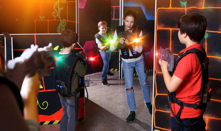 Kids playing laser tag on labyrinth
