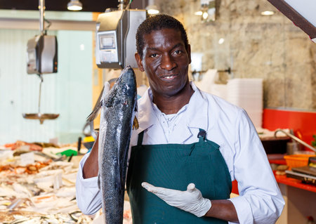 Salesman offering fresh fish