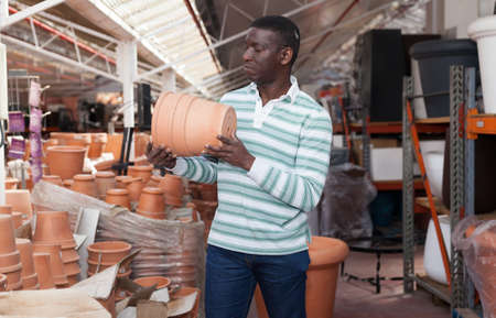 African American choosing pots for plantsの写真素材