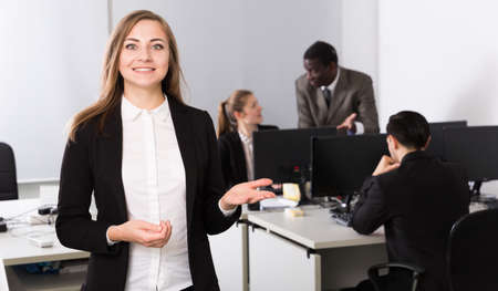 Businesswoman welcoming to officeの写真素材