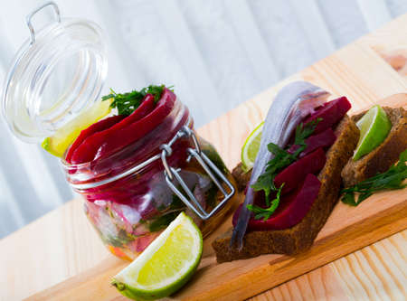 Marinated poutassou with beets, onions and marinade from lime juiceの写真素材