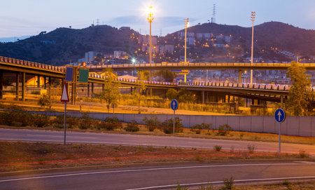 View of city highway in dusk with trace of blurred headlights