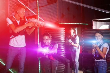 Pretty young girls took aim with laser guns