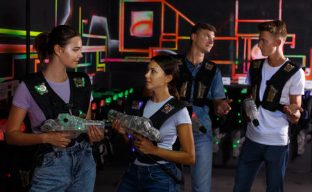Two girls talking during laser tag game