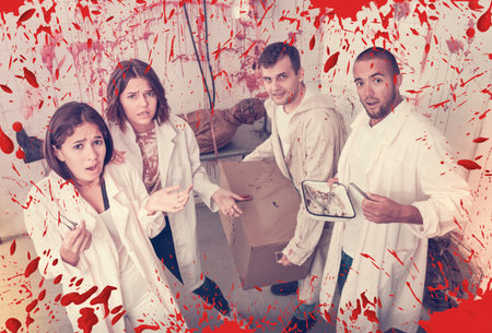 Friends in quest room with bloody traces