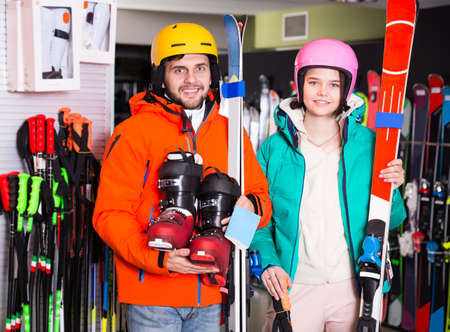 friends posing in full skiing gearの写真素材