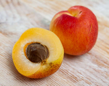 Apricots fruit on wooden table. Vitamin fruitsの写真素材