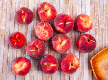 Juicy ripe peaches on wooden table