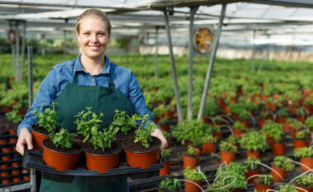 Female farmer posing in glasshouse