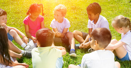 Portrait of children on the summer green lawn