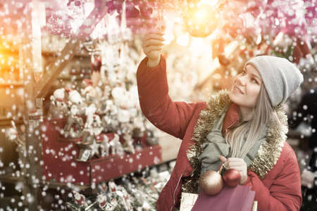 Girl shopping Christmas decorationsの写真素材