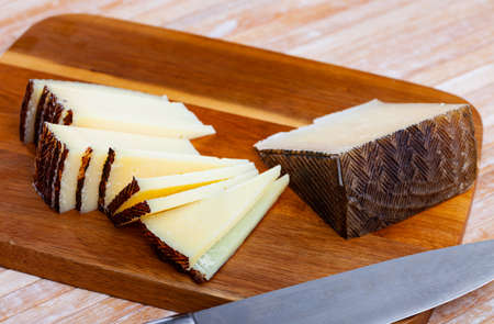 Sliced semi hard spanish sheep cheese Manchego, nobodyの写真素材