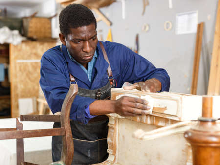 Restorer renewing vintage chest of drawersの写真素材