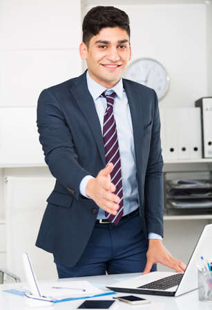 Man manager is going to meet first visitorsの写真素材