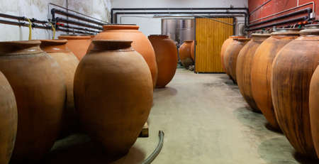 Clay vessels for wine fermentation in wineryの写真素材