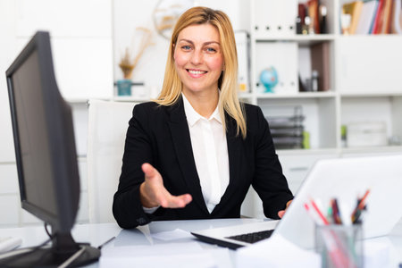 Young adult woman working at office