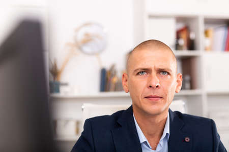 Portrait of businessman who is at his work placeの写真素材