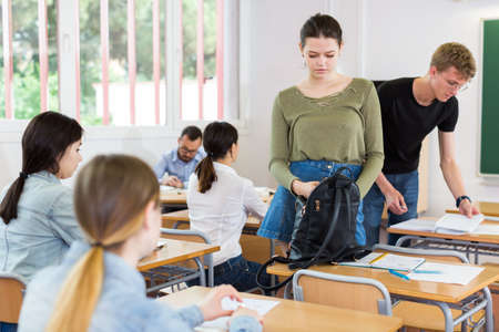 Girls and boys are preparing for lectureの写真素材