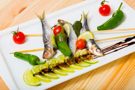 Anchovies roasted on grill with vegetablesの写真素材