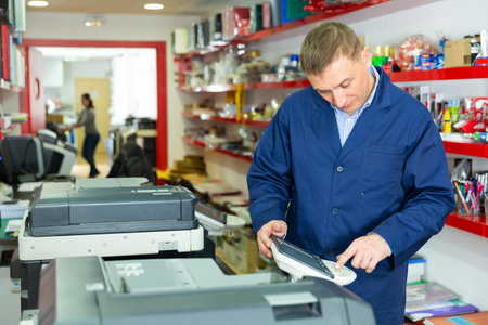 Service engineer using a copy machine